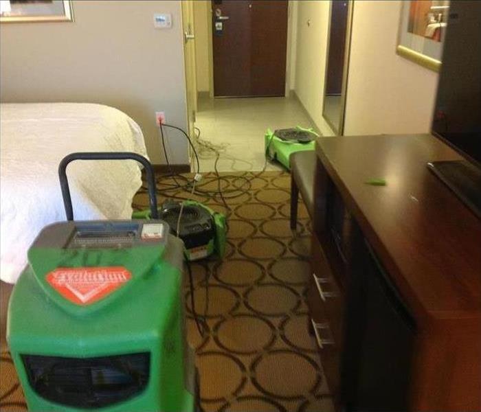 Dehumidifier and air mover inside a hotel room
